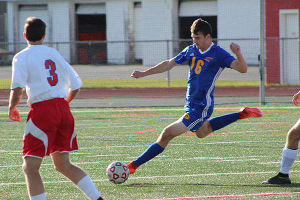 Cooper Latta striking the ball