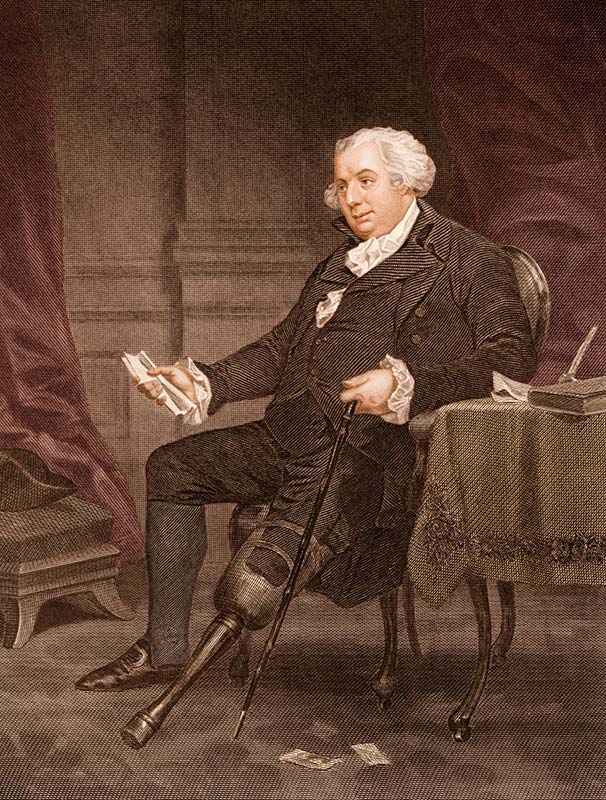 Gouverneur Morris posing in chair with a wooden leg and cane.