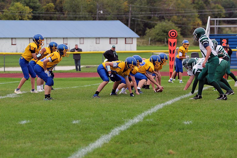 jv team at line of scrimmage ready to start the play