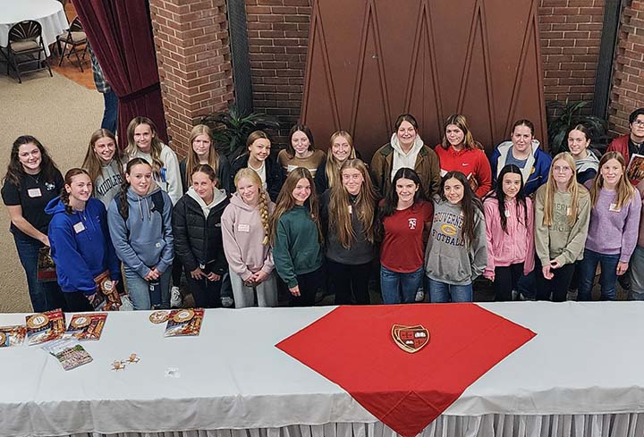 hs female students posing for picture at math event