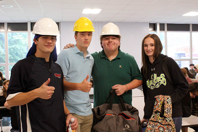 group of students in hard hats