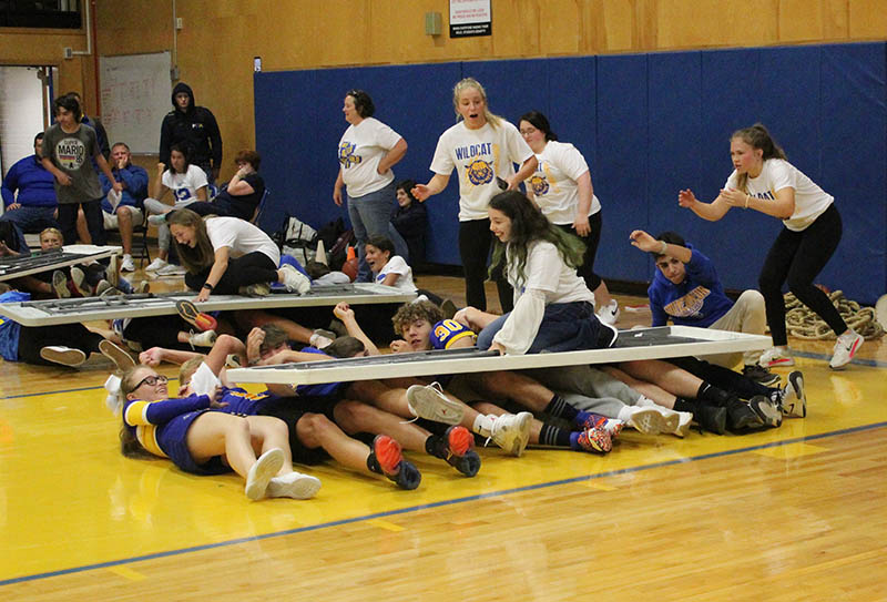 students table surfing at pep rally