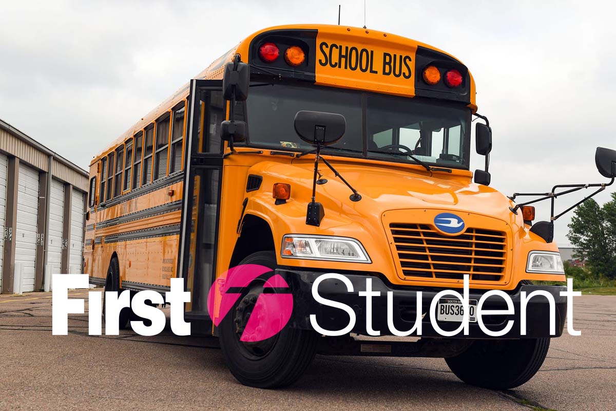 a bus and the first student's company logo