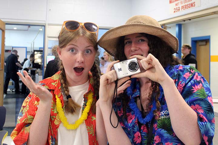 girls during spirit week using camera