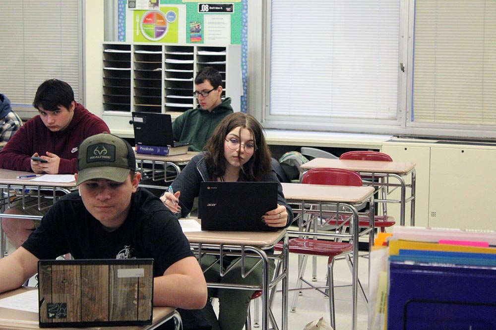 high school students using chromebooks in the classroom